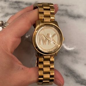 Gold watch, Michael Kors.  Needs new battery